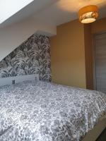 Łóżko lub łóżka w pokoju w obiekcie Les toits - Audun le Tiche - Appartement 3 chambres
