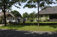 a house with a person in a bucket in the yard at Wolterdinger Hof in Soltau