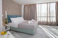 Posteľ alebo postele v izbe v ubytovaní Iconic Athens Suites