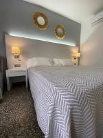 Postel nebo postele na pokoji v ubytování Hostal Pitiusa