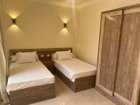A bed or beds in a room at MARINA SKY