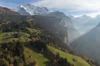 an aerial view of a valley with a mountain at Wengen Lauberhorn - Flat available in Wengen