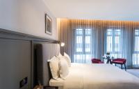 Ann Siang House, The Unlimited Collection managed by The Ascott Limitedにあるベッド