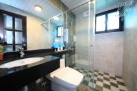 a bathroom with a toilet and a sink and a shower at Qixingtan Xinghai B&amp;B in Dahan