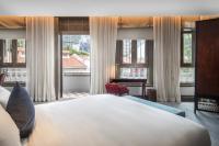 Ann Siang House, The Unlimited Collection managed by The Ascott Limitedにあるベッド