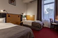 Hotel Poniatowskiにあるベッド