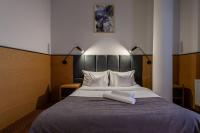 Hotel Poniatowskiにあるベッド