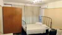 Posteľ alebo postele v izbe v ubytovaní Central Athens Pad