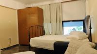 Posteľ alebo postele v izbe v ubytovaní Central Athens Pad