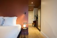 L'INVITATION AU VOYAGE - Hôtel & Spaにあるベッド