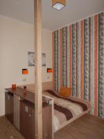Posteľ alebo postele v izbe v ubytovaní All In Apartman