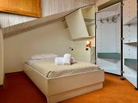 A bed or beds in a room at SIXTIES SUN & SEA MONTEROSSO