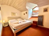 A bed or beds in a room at SIXTIES SUN & SEA MONTEROSSO