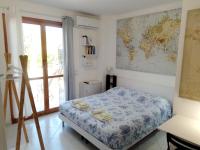 Postel nebo postele na pokoji v ubytování La Casa di Berenice a Porto Azzurro