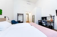 Posteľ alebo postele v izbe v ubytovaní Adagio Downtown Rooms