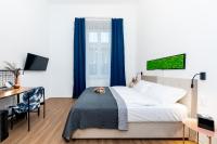 Posteľ alebo postele v izbe v ubytovaní Adagio Downtown Rooms