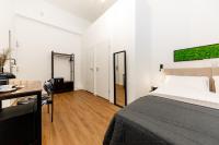 Posteľ alebo postele v izbe v ubytovaní Adagio Downtown Rooms