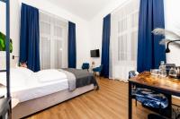 Posteľ alebo postele v izbe v ubytovaní Adagio Downtown Rooms