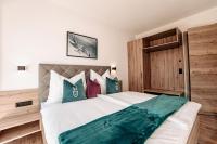 Posteľ alebo postele v izbe v ubytovaní Tanners Chalet Apartments
