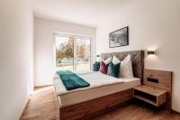 Posteľ alebo postele v izbe v ubytovaní Tanners Chalet Apartments