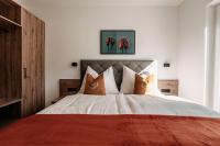 Posteľ alebo postele v izbe v ubytovaní Tanners Chalet Apartments