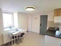 Kuchyň nebo kuchyňský kout v ubytování Apartmány ČERNÝ KOHOUT