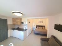 Kuchyň nebo kuchyňský kout v ubytování Apartmány ČERNÝ KOHOUT