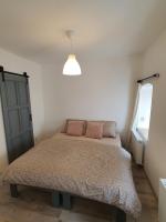 Postel nebo postele na pokoji v ubytování Apartmány ČERNÝ KOHOUT