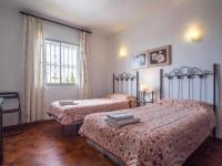 A bed or beds in a room at Villa Azahara