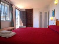 A bed or beds in a room at Villa Azahara
