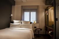 A bed or beds in a room at Letoh Letoh Gran Vía