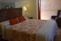 Cama o camas de una habitación en Hostal Rural Molino Del Bombo