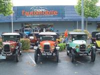 a group of antique cars parked in front of a store at Gîte Valençay, 4 pièces, 6 personnes - FR-1-591-148 in Valençay