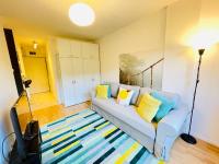 A seating area at Peony Holló Apartment - Free Garage under the house