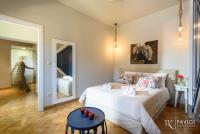 Postel nebo postele na pokoji v ubytování Candia Suites & Rooms