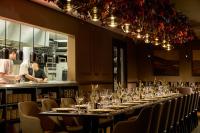 a long table in a restaurant with wine glasses at Castlemartyr Resort Hotel in Castlemartyr