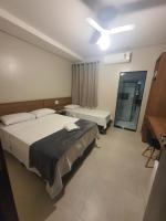 Ένα ή περισσότερα κρεβάτια σε δωμάτιο στο Hotel Tertulio&#39;s