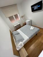 Postel nebo postele na pokoji v ubytování HOSPEDAJE COLONIA VALLECAS