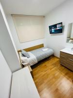 Postel nebo postele na pokoji v ubytování HOSPEDAJE COLONIA VALLECAS