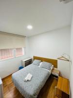 Postel nebo postele na pokoji v ubytování HOSPEDAJE COLONIA VALLECAS