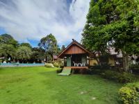 a small house in a field with a yard at Koh Chang Bailan Beach Resort in Ko Chang