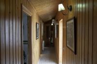 a hallway of a house with wooden walls at Casa Rural Las Cuevas de Setenil in Setenil