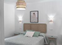 a bedroom with a bed with two pillows on it at Casa Rural Las Cuevas de Setenil in Setenil
