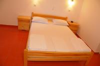 Łóżko lub łóżka w pokoju w obiekcie Chalikias Rooms
