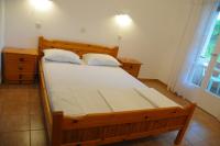 Łóżko lub łóżka w pokoju w obiekcie Chalikias Rooms