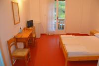 Łóżko lub łóżka w pokoju w obiekcie Chalikias Rooms