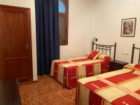 Posteľ alebo postele v izbe v ubytovaní Hotel Meson Fuente del Pino