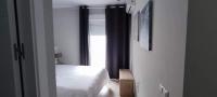 A bed or beds in a room at Guesting Hospital