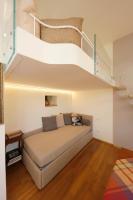 Posteľ alebo postele v izbe v ubytovaní Siena UpTown - Sabrina's Cozy Apartment