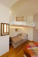 Posteľ alebo postele v izbe v ubytovaní Siena UpTown - Sabrina's Cozy Apartment